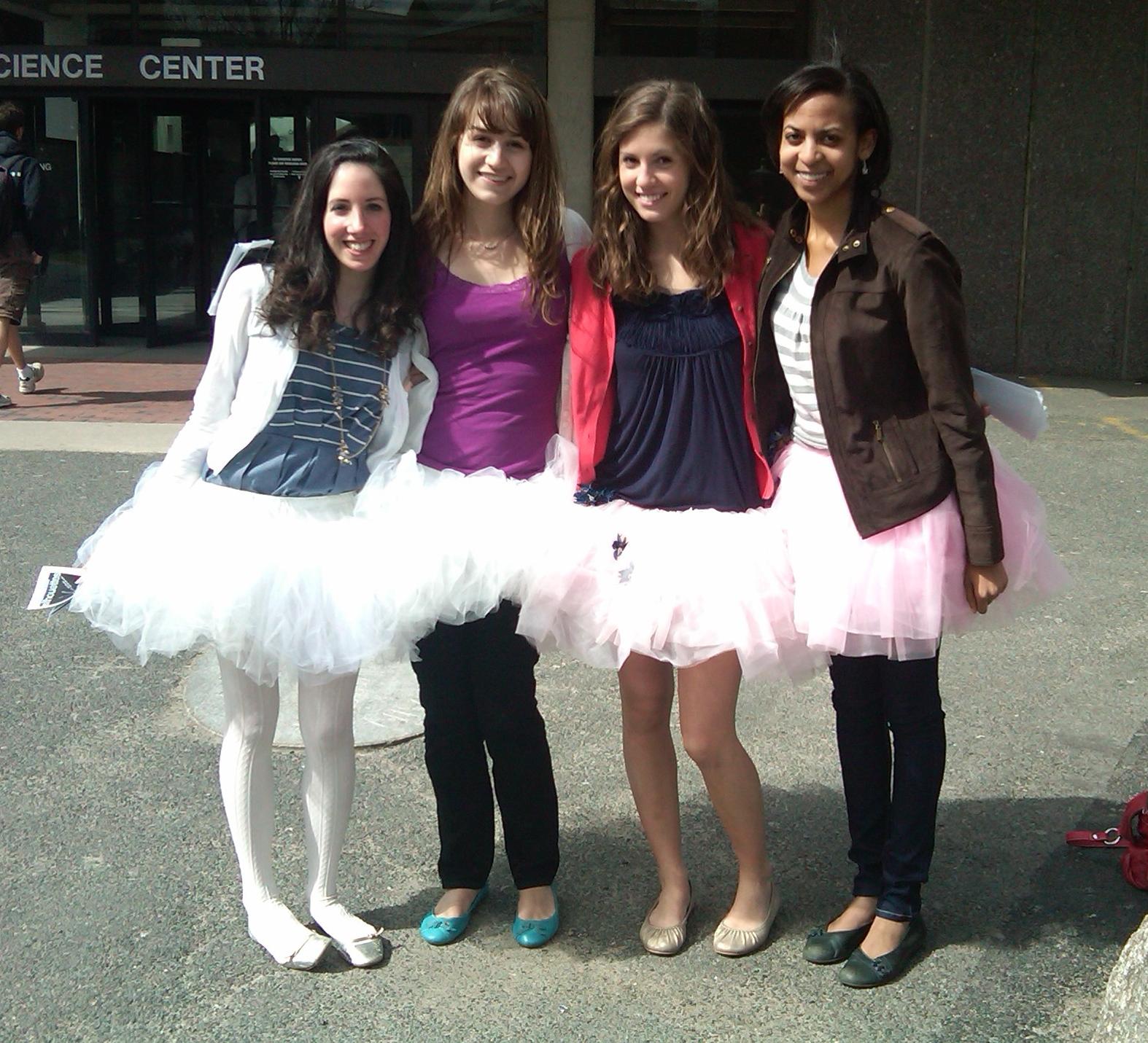 Four Ballet Teen Girls wearing White Tutus and Ballerinas